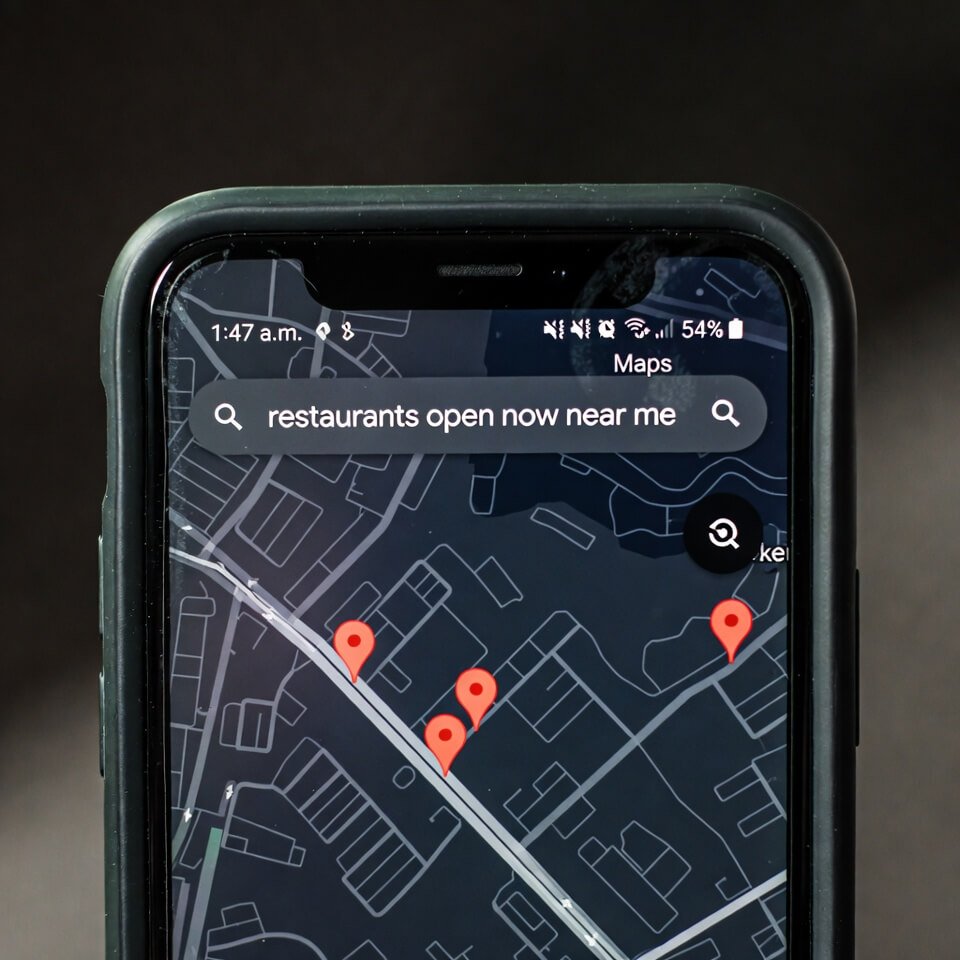Smartphone screen showing late-night restaurant search on Maps